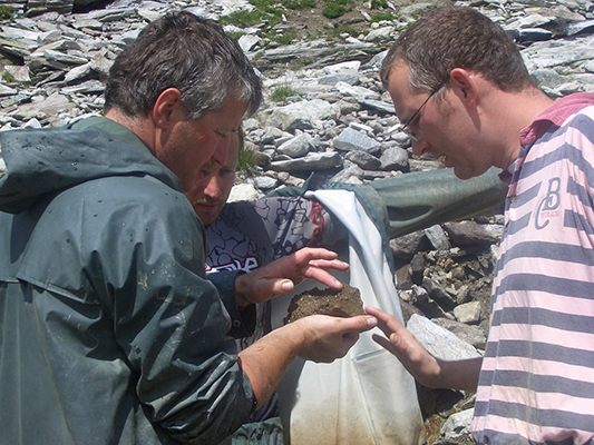Anton Watzl with Hofer brothers looking at a freshly collected specimen. Anton Watzl and Hofer brothers, Zillertal
